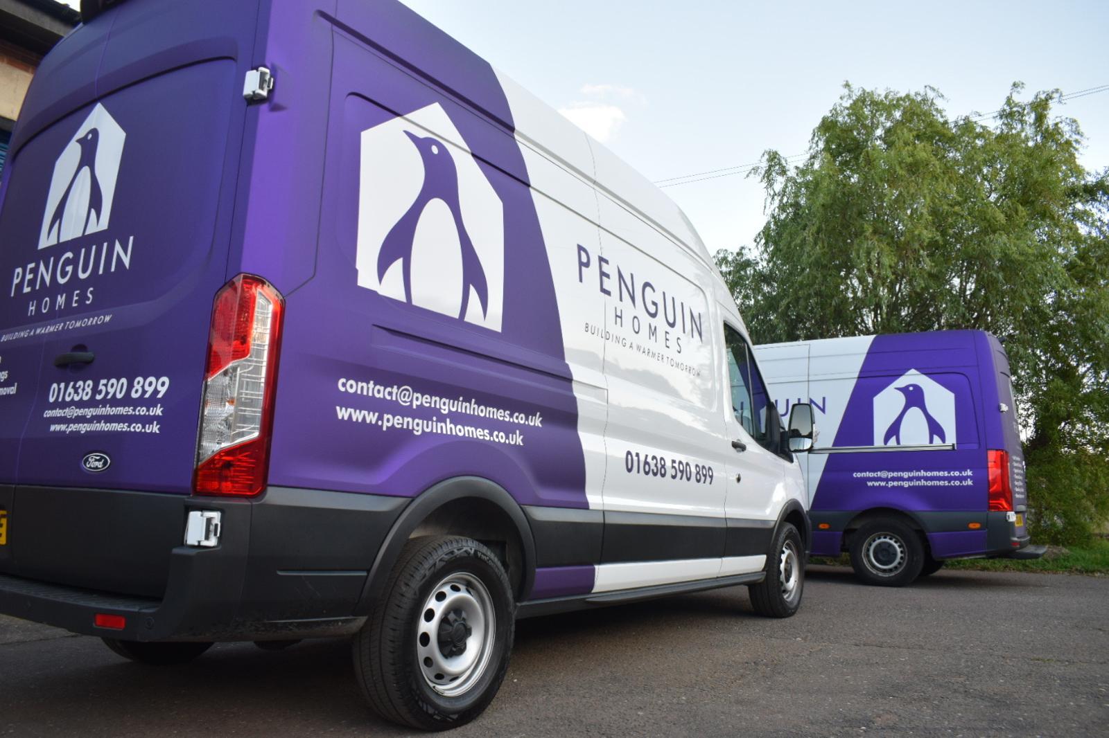 Penguin Homes branded installation vans